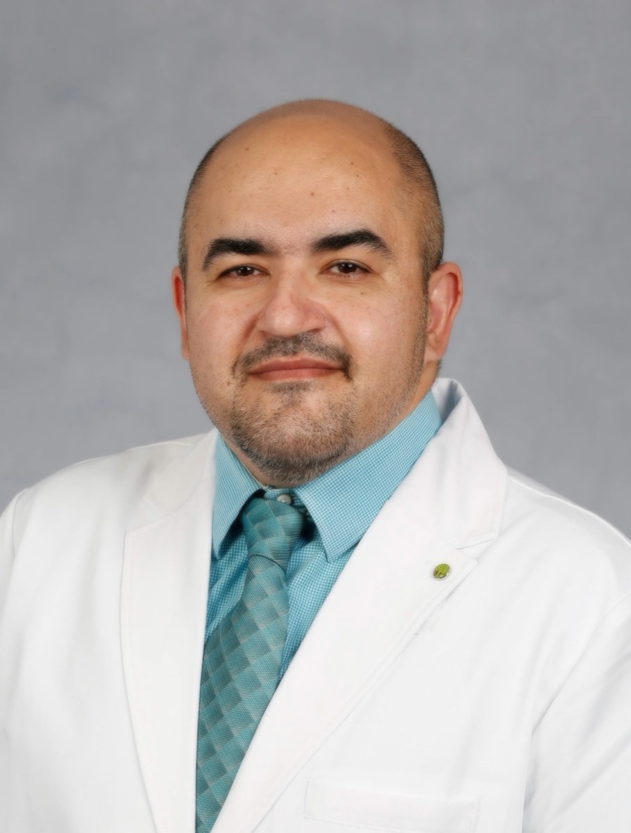 Dr. Angelo Sadeghpour in white coat